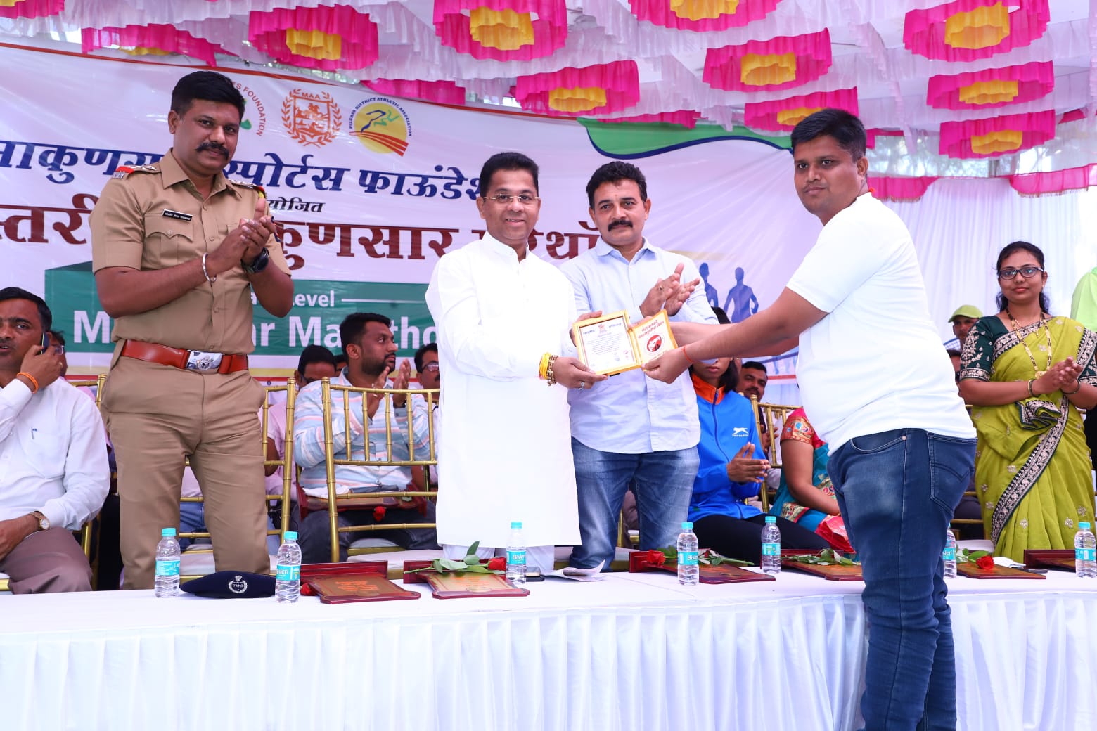 De-addiction poster display and swearing-in at Makunsar state level Marathon competition